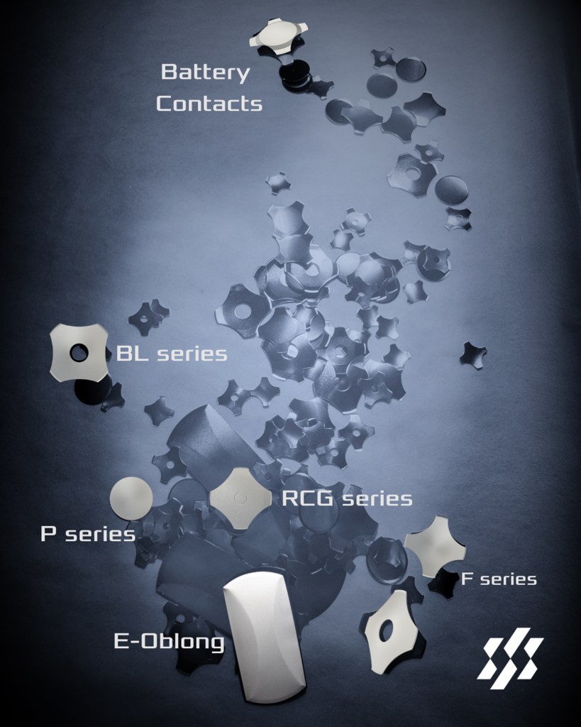 An assortment of battery contacts in various shapes and sizes, arranged on a dark background, with labeled categories for different series including BL, P, RCG, F, and E-Oblong.